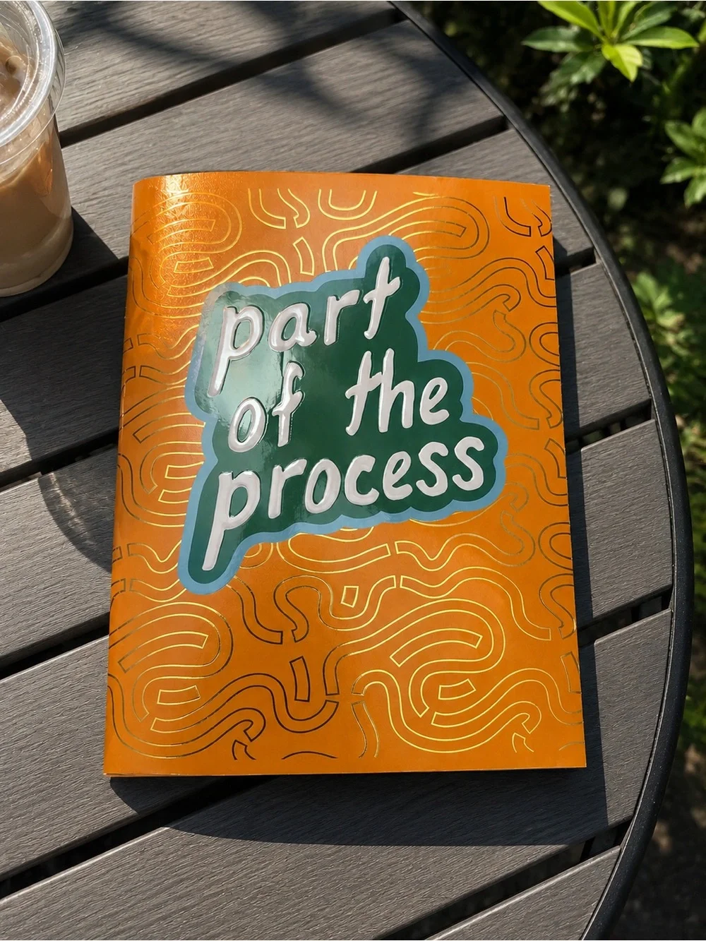 Orange Notebook with 'part of the process' Green Graphic